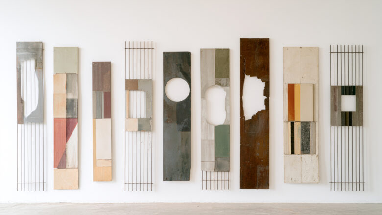 Nine mixed-media panels, abstract compositions in earth tones